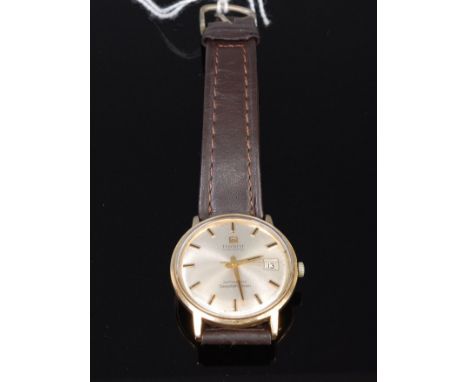 A gents Tissot Seastar 7 Visodate 9ct gold cased wrist watch having signed champagne dial, automatic movement, 3.4cm   Condit