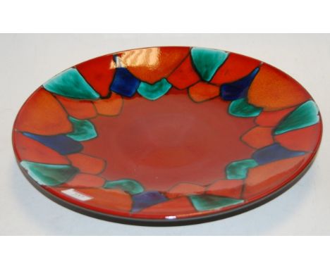A large modern Poole pottery harlequin charger, having printed mark verso, dia. 40cm