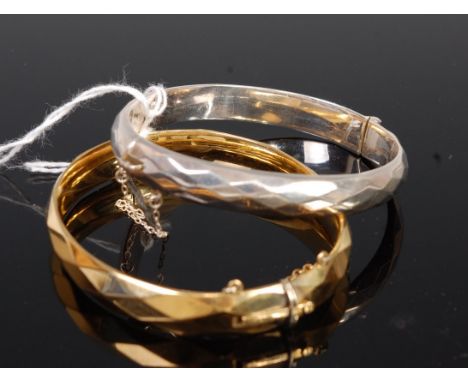 A rolled gold hinge bangle, and one other modern silver example (2)