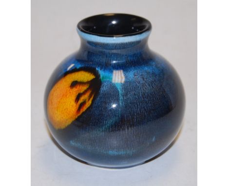 A small Poole pottery vase, of squat circular form, having raised Poole pottery dolphin mark England verso, h.11cm 