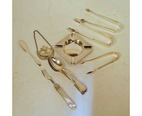 ***TWO PAIRS OF SUGAR TONGS REMOVED FROM THIS LOT*** A small collection of silverware, to include; a modern silver ashtray wi