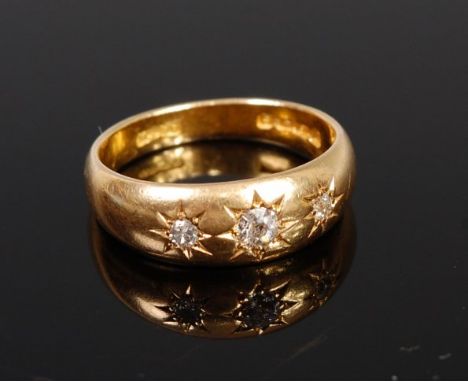 An 18ct gold and diamond gypsy ring, the centre old cut diamond weighing approx. 0.12ct, 5.5g, size N