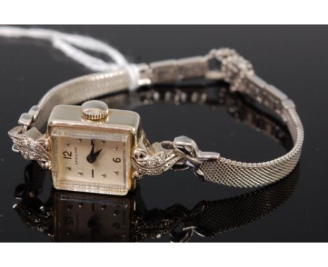 A Hamilton 14ct white gold ladies cocktail watch, having signed square dial and manual wind movement, the lugs each pavé set 