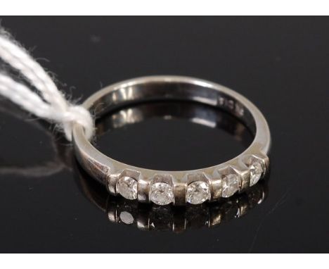 A modern 9ct white gold diamond half eternity ring, total diamond weight 0.25ct, 1.9g, size L/M