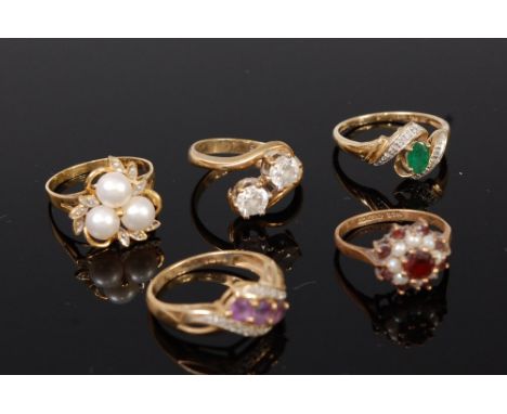 Three various modern 9ct gold semi precious set dress rings, one other earlier garnet and seed pearl example, and one other m