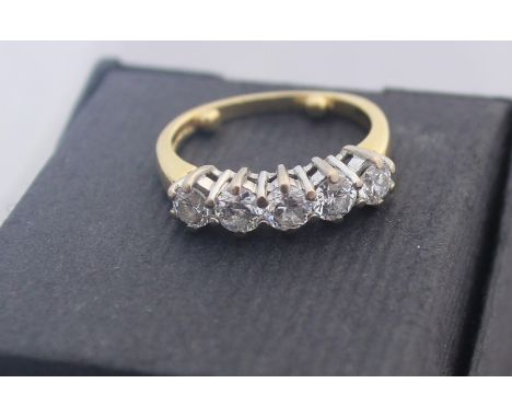 An 18ct. gold five stone diamond ring, set row of five round brilliant cut diamonds, (total diamond weight approx. 0.9 carats