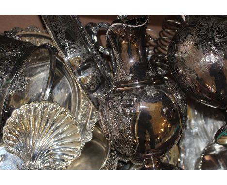 A small collection of silverware, to include; two silver napkin rings, a silver handled magnifying glass, a sterling silver s