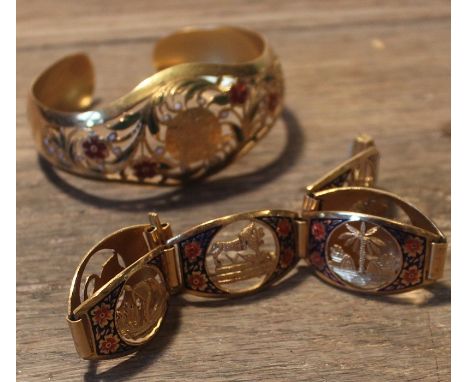 A Middle Eastern yellow metal and enamel bracelet, formed from six curved links, each having pierced panel depicting a lion m