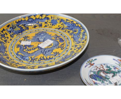 Two Chinese dishes, both decorated with Imperial 5 clawed dragons, the larger dish having five dragons on the inside chasing 