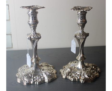 A pair of Late Victorian silver candlesticks, by Mappin Brothers, assayed Sheffield 1900, having wrythen stem with square scr