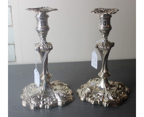 A pair of Late Victorian silver candlesticks, by Mappin Brothers, assayed Sheffield 1900, having wrythen stem with square scr