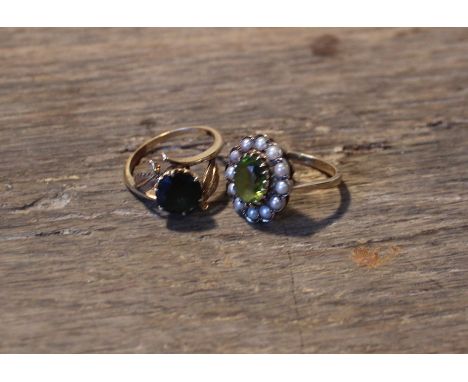 A 9ct. yellow gold, peridot and seed pearl ring,&nbsp;the lobed oval mount set oval mixed cut peridot to centre surrounded by