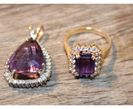 A 14ct. gold, amethyst and diamond pendant, claw set central pear-cut amethyst within border set numerous round cut diamonds,