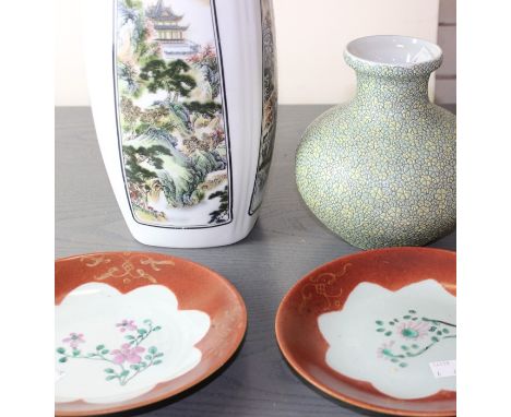 Four Chinese porcelain items to include a labelled pair collection of 'Jiaqing' period famille rose on coral ground plates a 