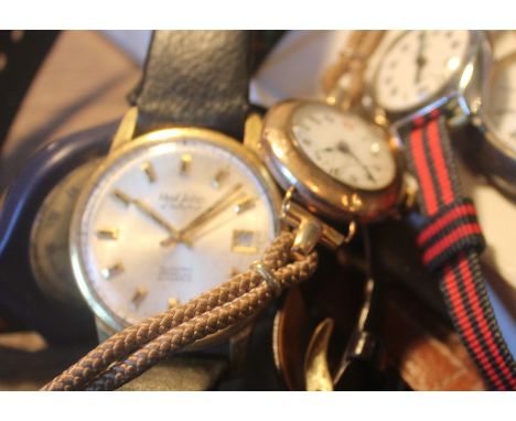 A 9ct. rose gold ladies' wrist watch, having circular white enamel Arabic numeral dial, 25mm wide case stamped "9, 375" to in