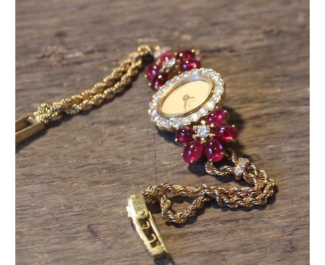 A Montre Royale de Geneve gold, ruby and diamond ladies' bracelet watch, c.1982, Bueche-Girod quartz movement, having signed 