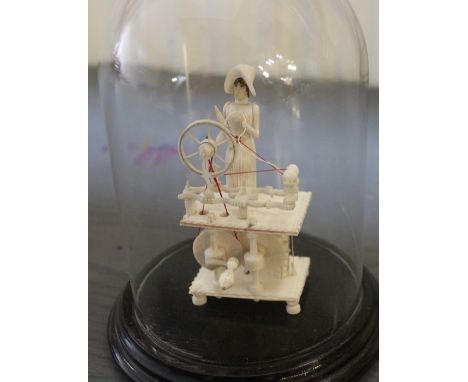 A Spinning Jenny model housed within glass dome