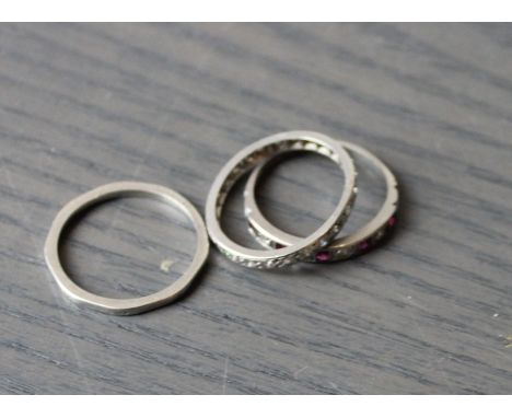 A white metal and diamond eternity ring, set numerous round cut diamonds, (white metal assessed as platinum), together with a