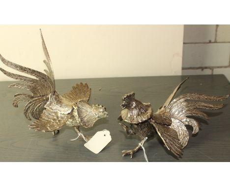 A pair of Japanese white metal cockerels, each length 19cm. (2)
