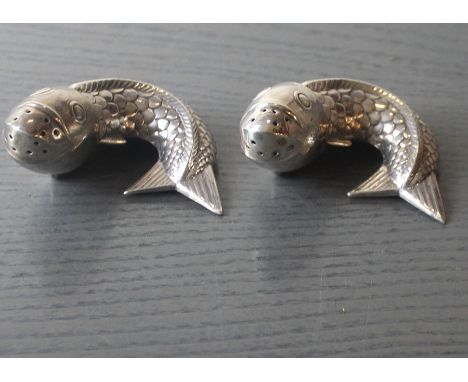 A pair of Norwegian sterling silver novelty salt and pepper cruets fashioned as fish,&nbsp;20th century(), stamped "925S" and
