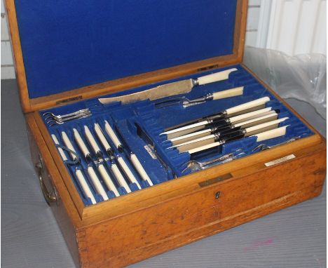 A Mappin &amp; Webb oak canteen chest, with ivorine Mappin &amp; Webb plaquette, fitted felt lined trays containing Mappin &a