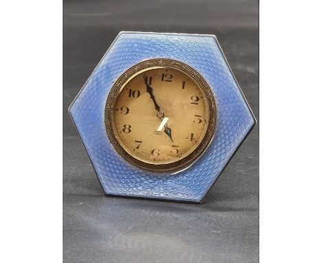 An Art Deco silver and blue guilloche enamel hexagonal easel back timepiece, Birmingham 1929, 7.5cm high. 