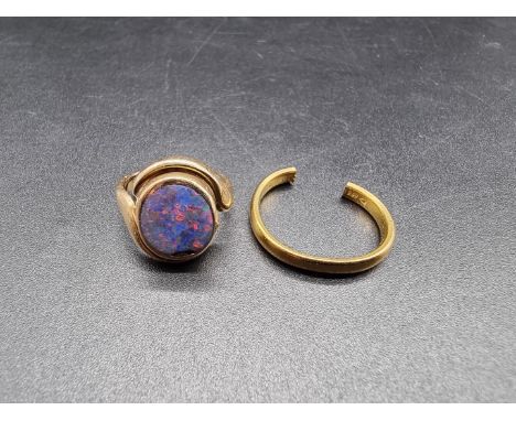 A 22ct gold wedding band, (cut), 4.2g; together with a yellow metal ring set opal doublet, (damaged). (2) 