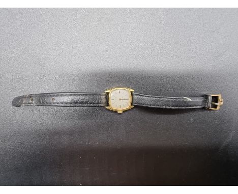 A vintage Omega De Ville gold plated ladies manual wind wristwatch, 18mm, cal 485, on black leather strap. 