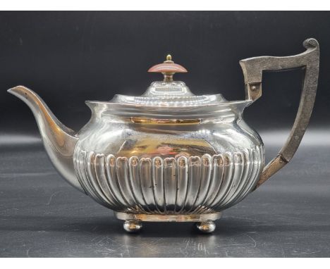 An Edwardian silver teapot, by Walker &amp; Hall, Sheffield 1902, 537g all in, 16cm high. 