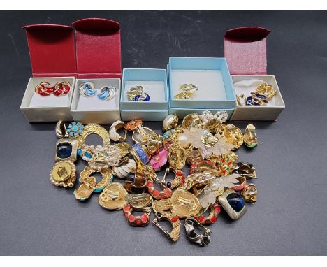 A collection of costume earclips,&nbsp;some enamel and pearl set. 