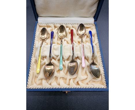 A cased set of six Norwegian silver gilt and coloured enamel coffee spoons, stamped '925', in David Anderson' case. 