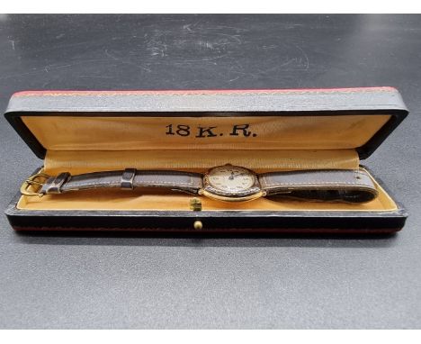 A vintage Liga yellow metal ladies manual wind wristwatch,&nbsp;23mm, stamped 18k, on leather strap. 