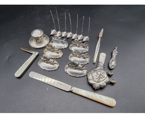 A small quantity of silver and EPNS items,&nbsp;to include menu holders, a child's rattle, inkwell, etc. 