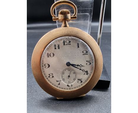 An Art Deco 9ct gold engine turned open faced pocket watch, stem wind, 4.5cm diameter. 