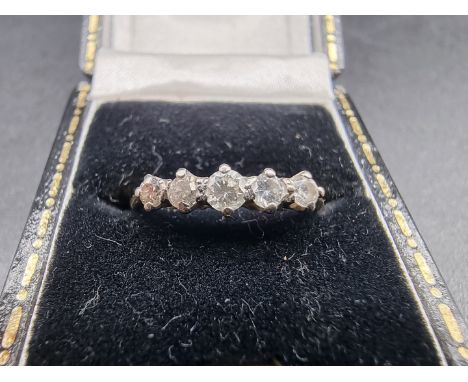 A yellow metal diamond five stone ring, size K, gross weight 1.4g. 