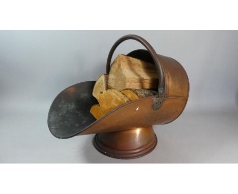 A Late 19th Century Copper Helmet Shaped Coal Scuttle, 43cm Long 