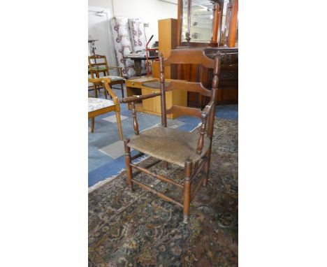 An Edwardian Rush Seated Ladder Back Arm Chair 
