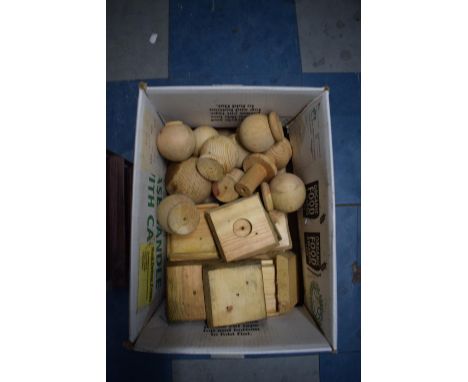 A Box Containing Wooden Fence Box Finials and Post Caps 