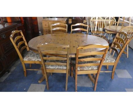 A Ducal Pine Extending Dining Table and Set of Six Ladder Back Tapestry Seated Chairs 