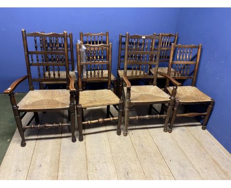 Eight ladder back, rush seated country chairs, (6 +2); some wear to the rush seats 