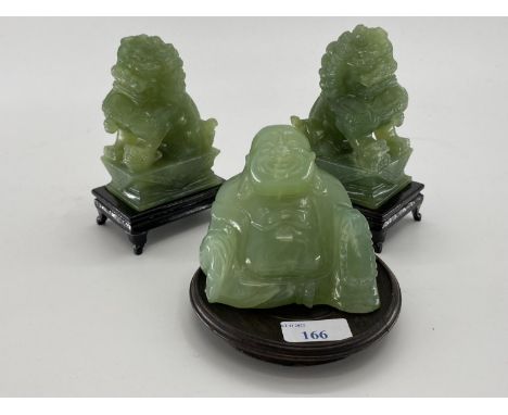 Pair of C20th  Jade dogs of fo on hardwood stands, and a jade buddha on circular stand 