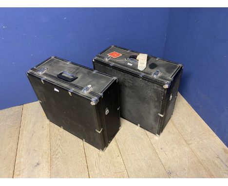 Two black vintage travelling square trunks 