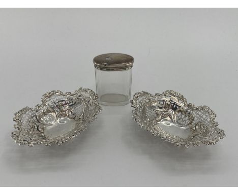 A pair of sterling silver pierced oval dishes, and a silver topped glass dressing table item silver weight 182g 