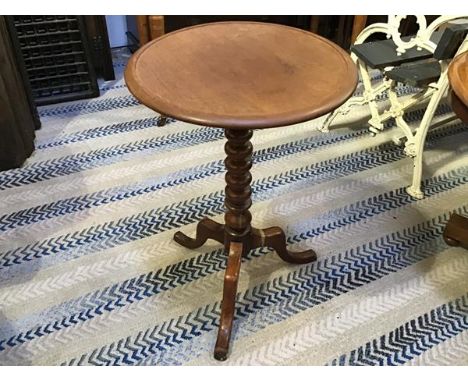 A 19thc mahogany occasional table, the saucer top raised on ring turned column and tripod support (base restored) (h.66cm x d