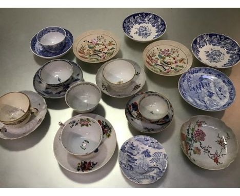 A group of English china blue and white saucers, tea bowls, teacups etc. with painted enamel decoration, a Japanese Imari sty