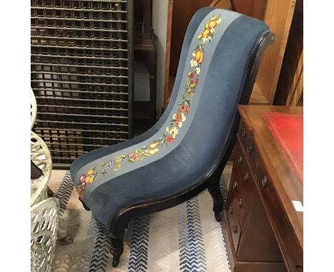 An Edwardian ebonised frame scroll back prie dieu style chair, with central tapestry back panel, raised on turned tapered sup