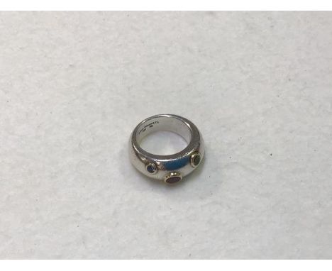 A Tiffany bombe style gem set ring, including sapphire, peridot and pink spinnel, stamped 2001, Tiffany &amp; Co. 925 750, co