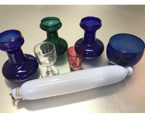 A collection of glass to include two Bristol blue glass hyacinth vases, a green glass hyacinth vase, a blue glass finger bowl