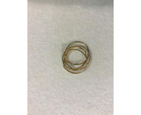 A yellow metal puzzle ring (approx. K) (2.55g)