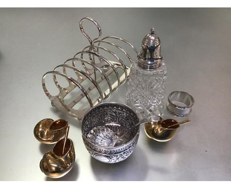 A mixed lot comprising an Eastern white metal chased circular sugar basin (h.5cm), a London silver mounted crystal sugar cast